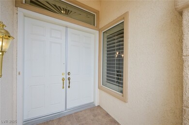 Entrance to property featuring stucco siding