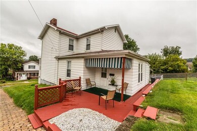 Covered porch leads into kitchen. Perfect for visi