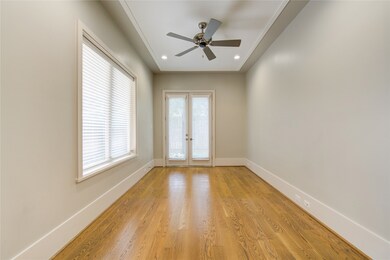 This room features hardwood floors, neutral walls,