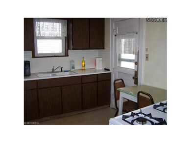 The kitchen has easy to clean formica cabinets and
