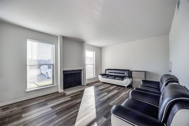 Living room with dark hardwood / wood-style flooring