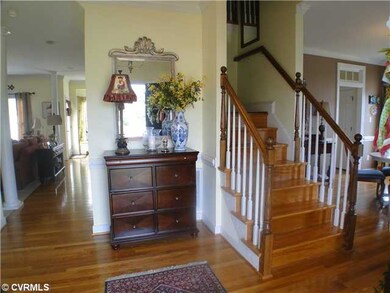 Foyer - Elegant Foyer With Turned Wood Stairs Lead