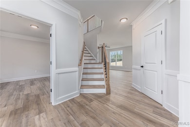Stairs featuring light hardwood / wood-style floor