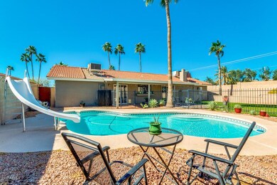 Fenced pool and slide