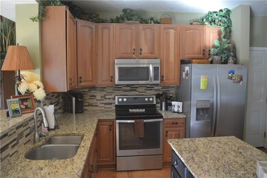 Natural cherry color cabinets, updated ss applianc
