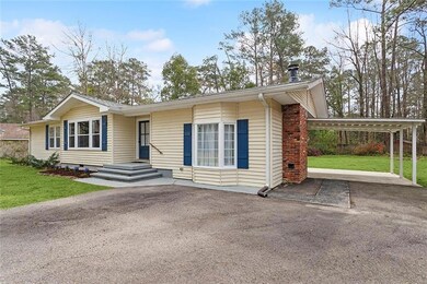 view of car port and back yard