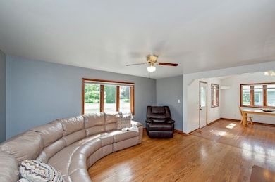 LIVING ROOM WITH HARDWOOD FLOORS THAT OPEN TO THE 