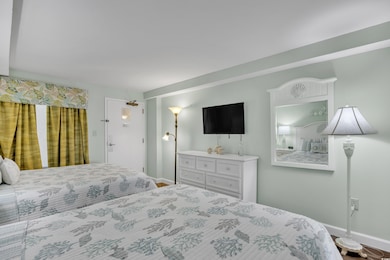 Bedroom featuring baseboards
