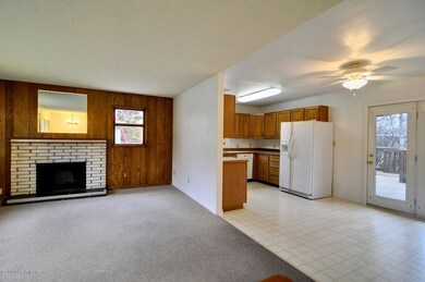 Living Room opens to Dining and Kitchen