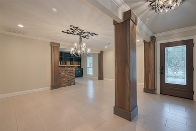 This inviting entryway features elegant tile floor