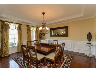 Formal Dining Room with hardwood floors, columns, 