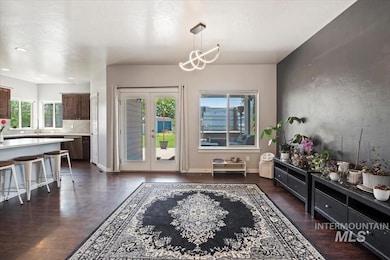 Dining space with french doors and baseboards