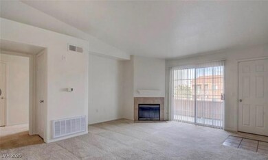 Unfurnished living room with carpet and a fireplac