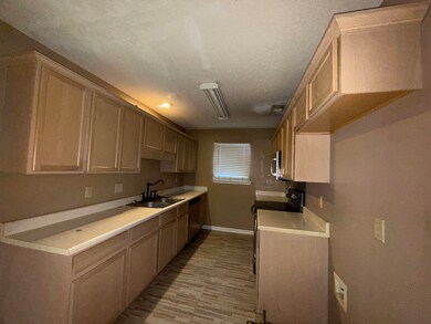 Kitchen with sink, stainless steel appliances, a t