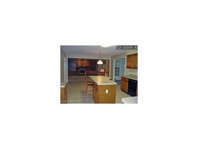 Kitchen opens to family room and sun room