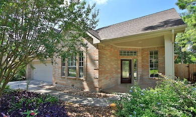 Step into elegance through the covered patio featu