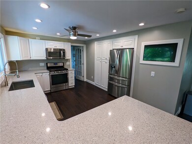 Newer gleaming quartz counter tops with peninsula