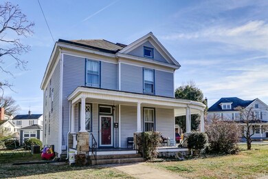 FRONT OF HOME.  NICE WRAP AROUND PORCH TO ENJOY.
