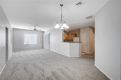 Unfurnished living room featuring light carpet, a
