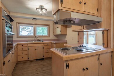 Kitchen features lots of cabinets and counterspace
