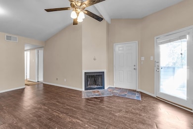 Unfurnished living room featuring dark wood-type f