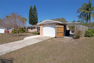 Front gate opens up to a covered carport. Perfect 