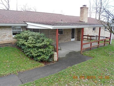 Exterior Back. Covered rear porch, access from kit