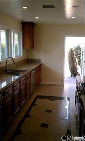 Beautiful Tile Work, Recessed Lights, and Stainles