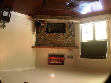 Living Room. Beautiful Stone Wood Burning Fireplac