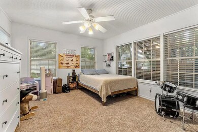 Bedroom with carpet flooring and a ceiling fan