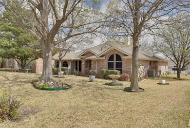 This home is on a large, one-third (.336ac) acre lot.  Imagine these mature trees this summer!  Concrete edging defines the flower beds and you'll have plenty of space for parking or playing on this terrific lot.