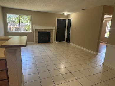 Unfurnished living room with a textured ceiling, 