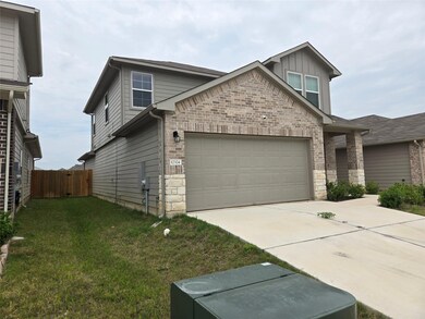 View of front of property featuring driveway, sto