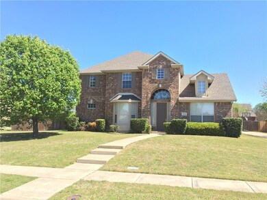 Colonial home with a front yard