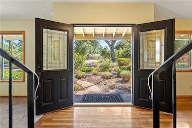 The home welcomes you with an impressive double door front door.