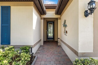 Doorway to property featuring stucco siding