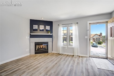 Unfurnished living room with wood finished floors,
