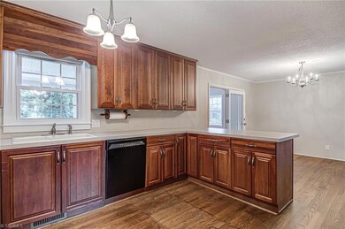 Another view of the Kitchen overlooking the Backyard.