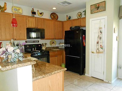 Property Photo. Kitchen has a pantry and tile floo