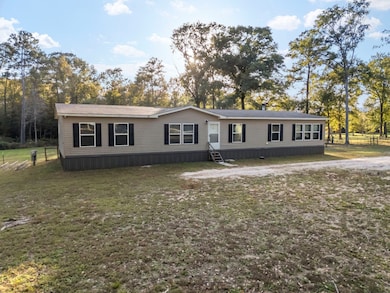 The primary home features a large, fenced-in backyard perfect for relaxation and outdoor activities.