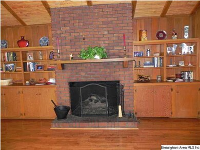 SPACIOUS DEN/FAMILY ROOM WITH BUILT-IN BOOK SHELVE