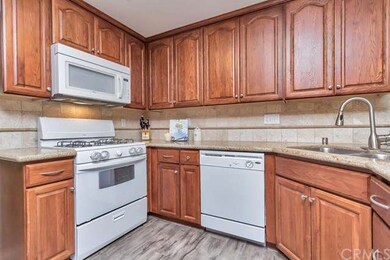 Gorgeous kitchen is fully appointed with granite c