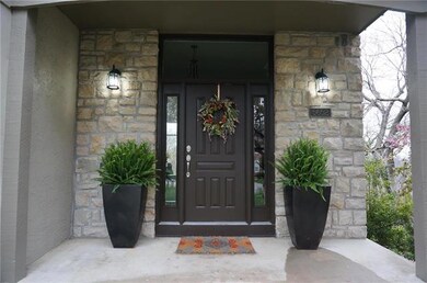 Stone entry w/large porch