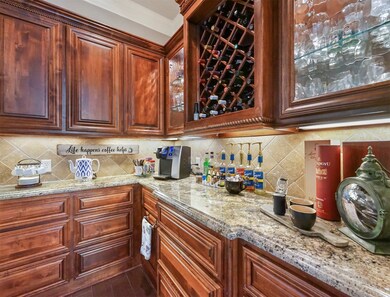 The wine room offers granite counters, lots of storage & even doubles as a coffee bar