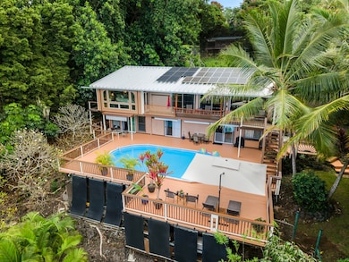 Large home with main living areas upstairs, and extra guest rooms downstairs. Note the solar panels on roof that power entire home.