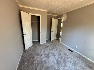 Unfurnished bedroom featuring carpet flooring, bas
