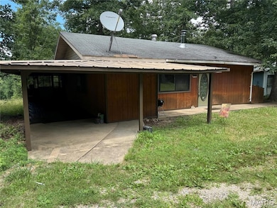 View of front of house featuring an attached carport
