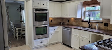 You'll love the extra capacity of having 2 ovens!  Beautifully updated kitchen with granite and under cabinet lighting