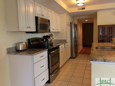 KITCHEN WITH GRANITE COUNTER TOPS AND STAINLESS ST