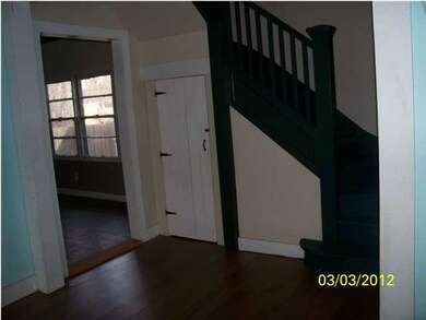 The foyer as you walk in. Notice the fun staircase